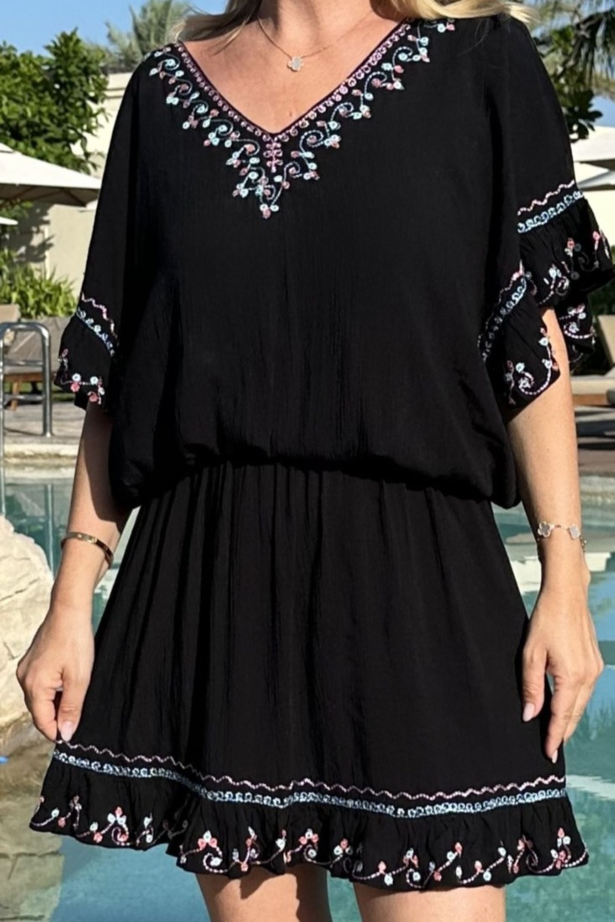 Black cotton bloused beach dresses by Lindsey Brown resort wear