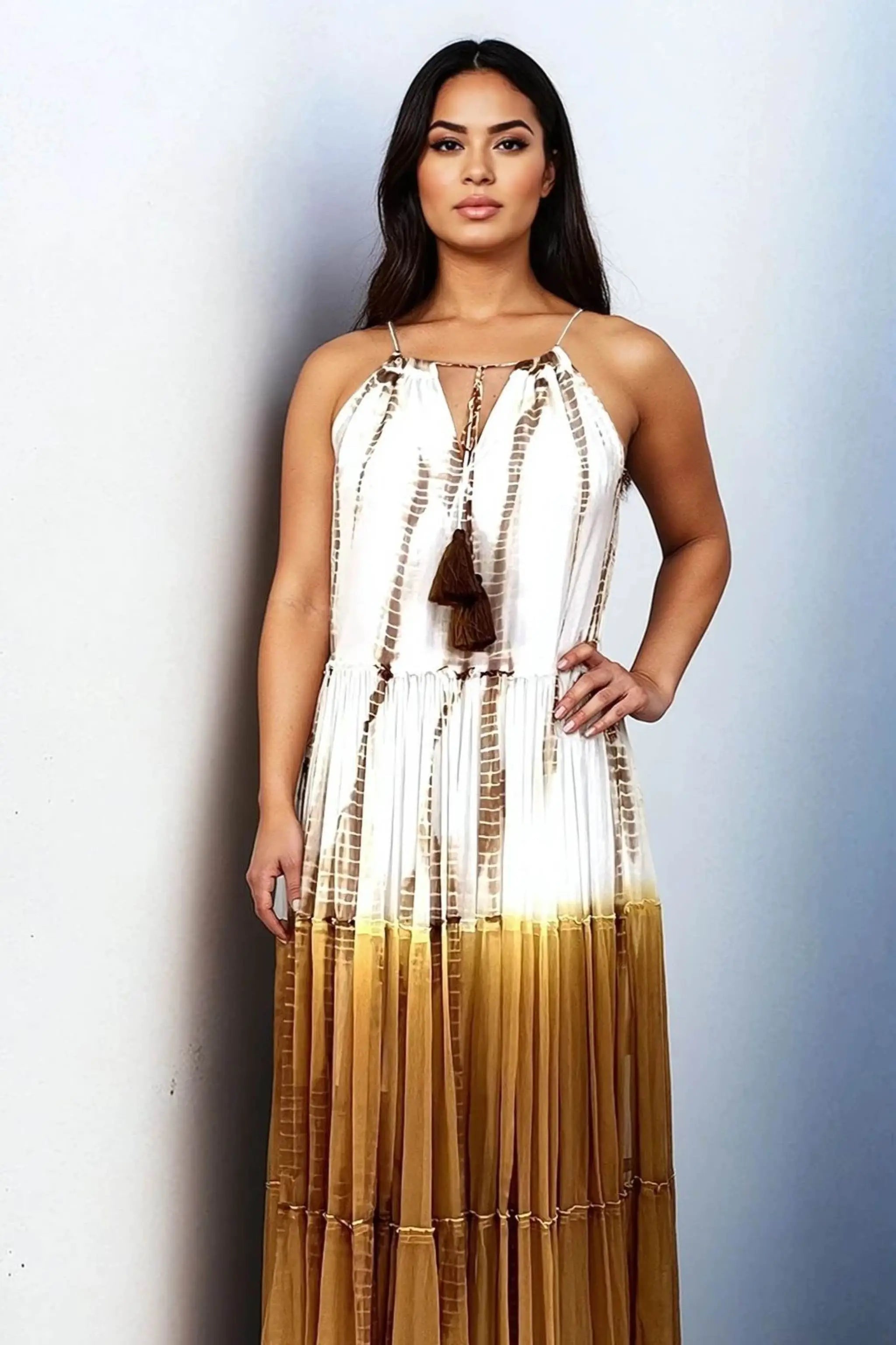 brown and white tie dye silk maxi dresses to wear on holiday by Lindsey Brown resort wear 

