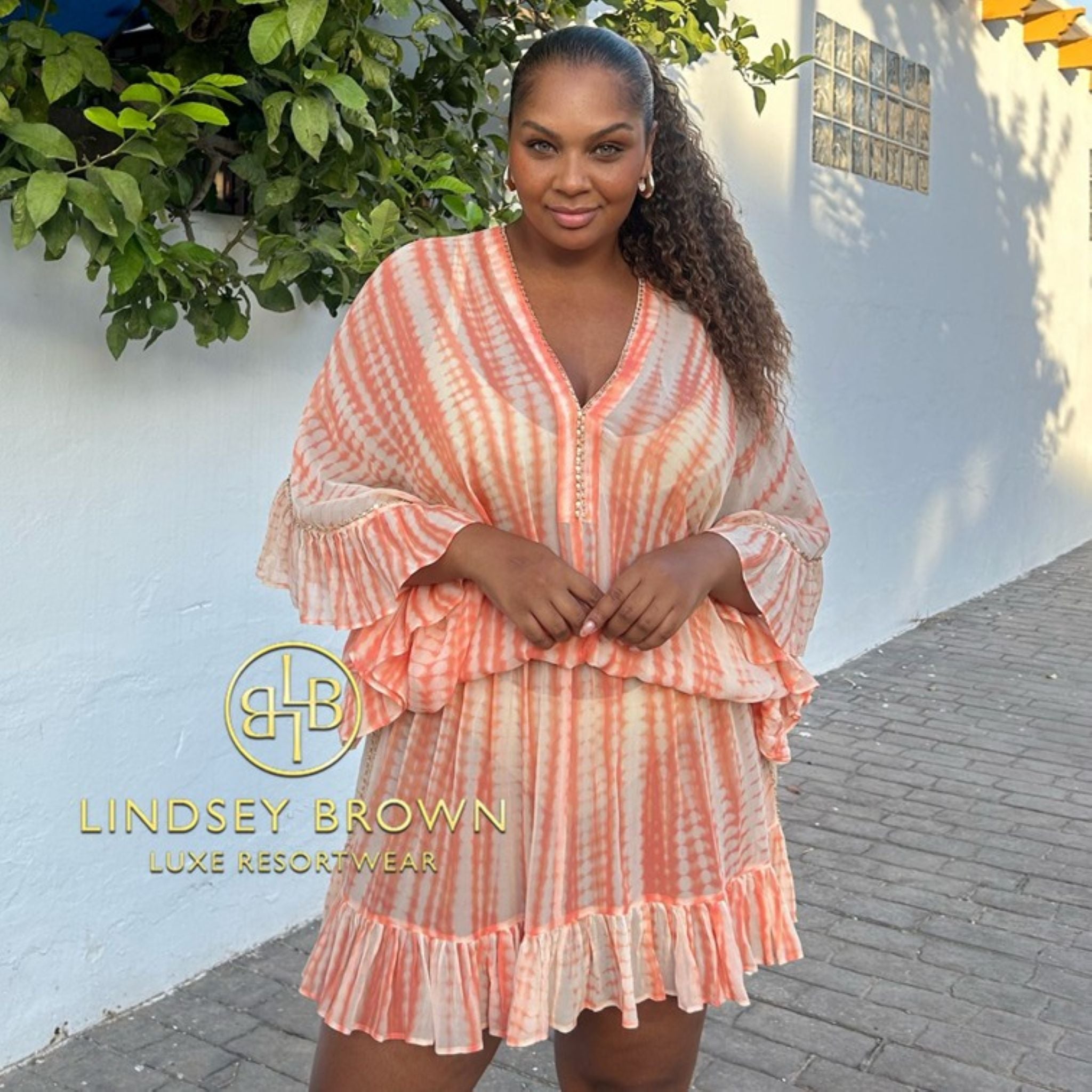 peach hand tie dye silk bloused beach dress by Lindsey Brown resort wear 