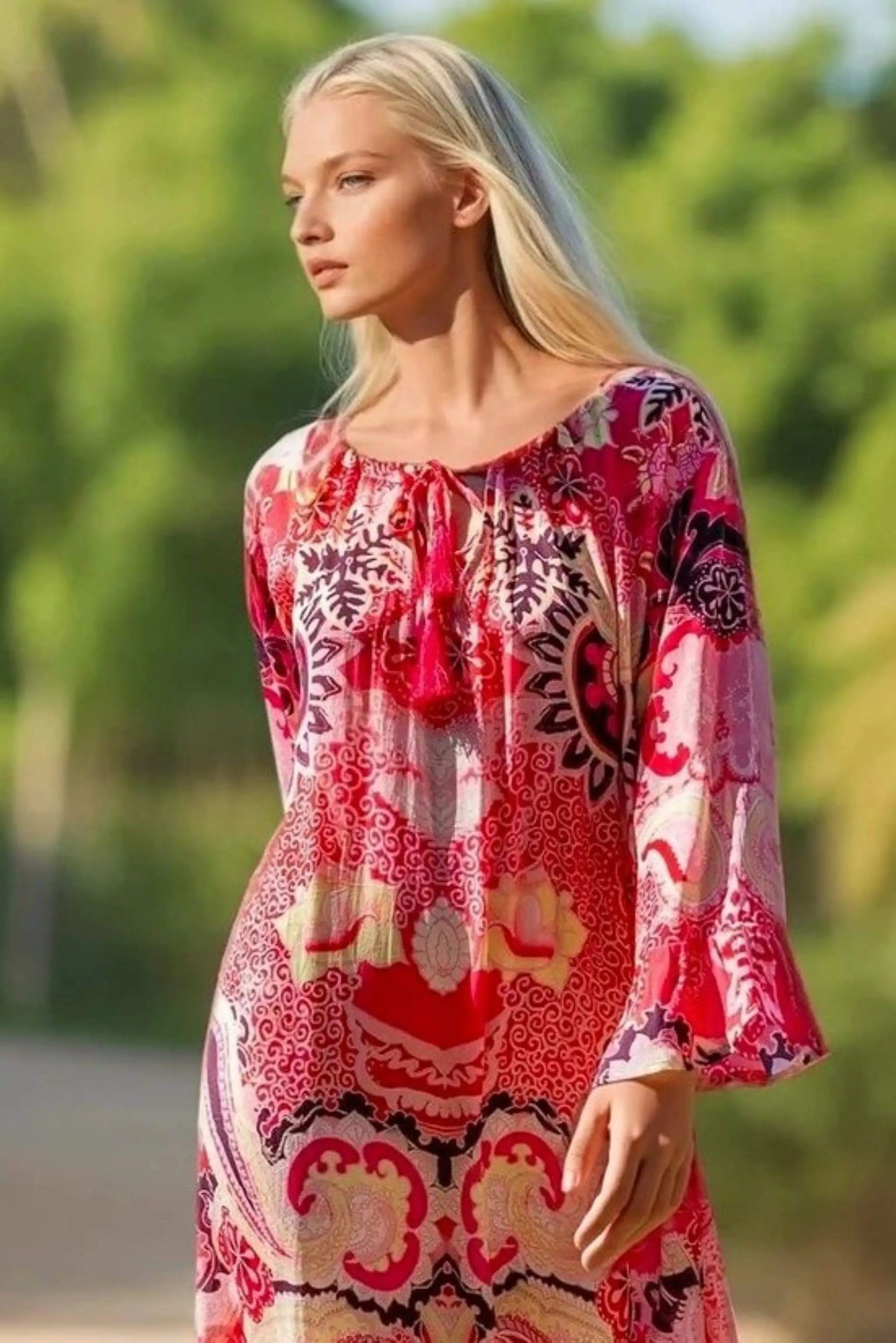 pink long sleeved knee length dress to wear on holiday by Lindsey Brown resort wear